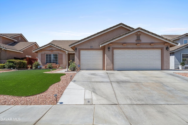 3267 Desert Cloud Ave, Rosamond, CA 93560 - ranch-style house featuring driveway, an attached garage, a front yard, stucco siding, and a tiled roof