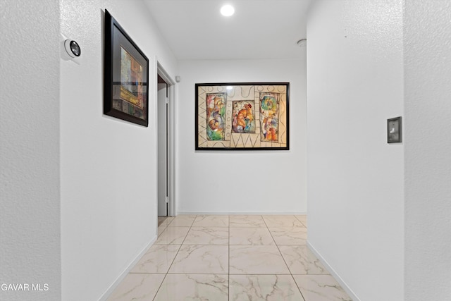 3267 Desert Cloud Ave, Rosamond, CA 93560 - corridor featuring light marble finish floors and baseboards