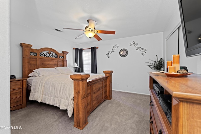 3267 Desert Cloud Ave, Rosamond, CA 93560 - bedroom with light carpet, a closet, and ceiling fan