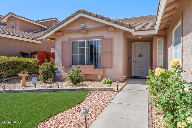 3267 Desert Cloud Ave, Rosamond, CA 93560 - entrance to property featuring stucco siding and a tiled roof
