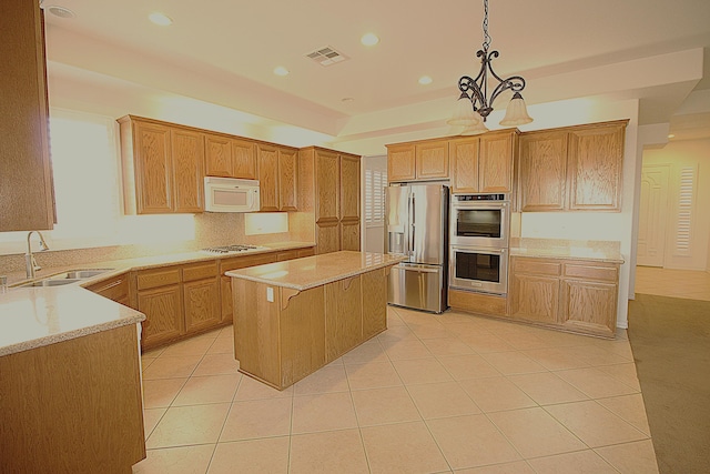 kitchen featuring sink, stainless steel appliances, a notable chandelier, decorative light fixtures, and light tile patterned flooring