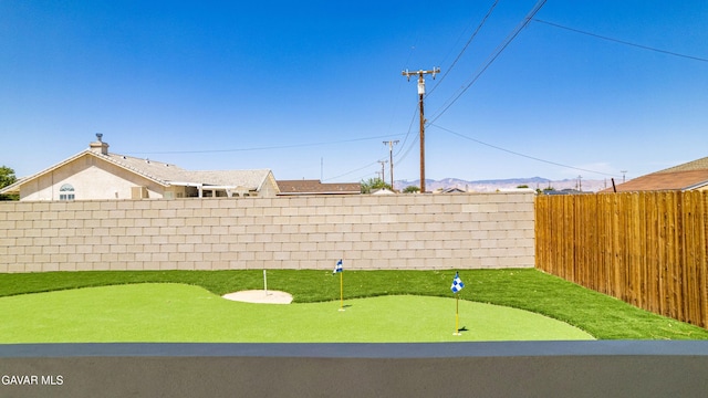 9207 Margery Ave, California City, CA 93505 - fenced backyard featuring a putting green