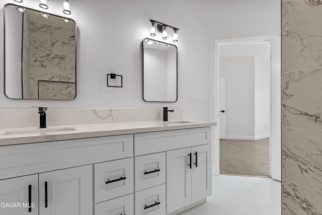 9207 Margery Ave, California City, CA 93505 - bathroom with double vanity and baseboards
