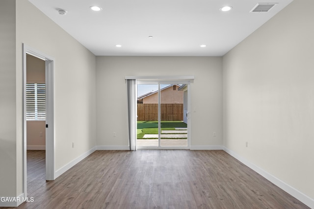 9207 Margery Ave, California City, CA 93505 - spare room with wood finished floors, a smoke detector, and recessed lighting