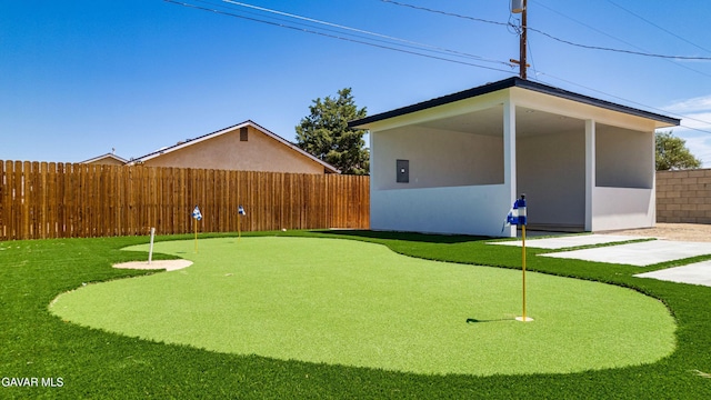 9207 Margery Ave, California City, CA 93505 - view of yard with a putting green and a patio area