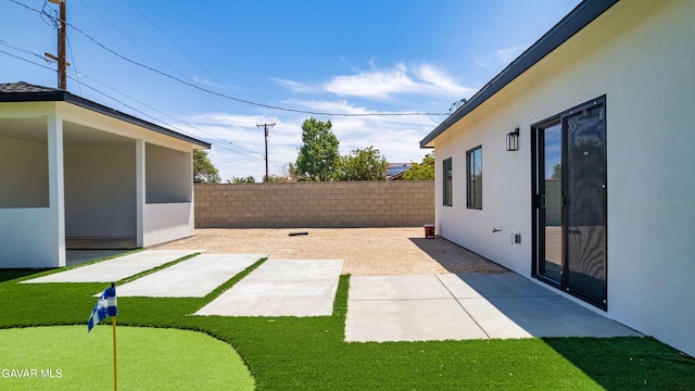 9207 Margery Ave, California City, CA 93505 - fenced backyard featuring a patio