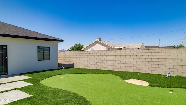 9207 Margery Ave, California City, CA 93505 - fenced yard with a putting green