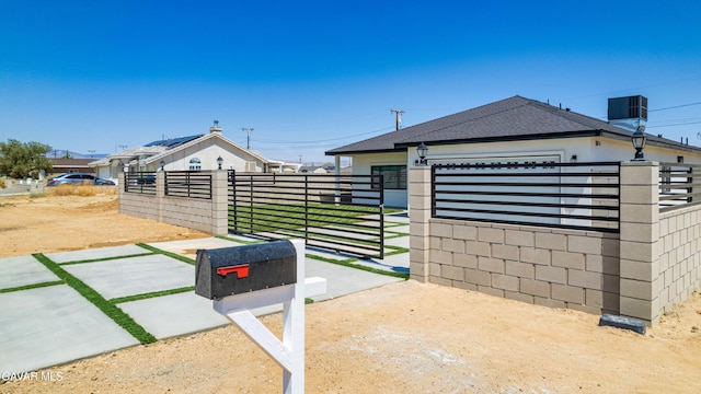 9207 Margery Ave, California City, CA 93505 - view of front of home featuring a fenced front yard and a shingled roof
