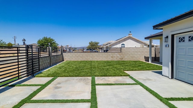 9207 Margery Ave, California City, CA 93505 - fenced backyard featuring a patio