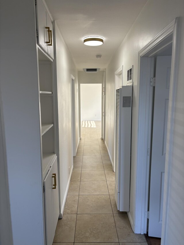38810 Foxholm Dr, Palmdale, CA 93551 - corridor with a heating unit and light tile patterned floors