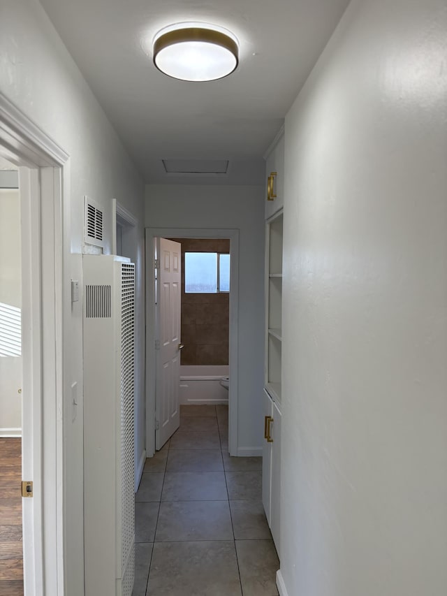 38810 Foxholm Dr, Palmdale, CA 93551 - hallway featuring a heating unit, attic access, light tile patterned floors, and baseboards