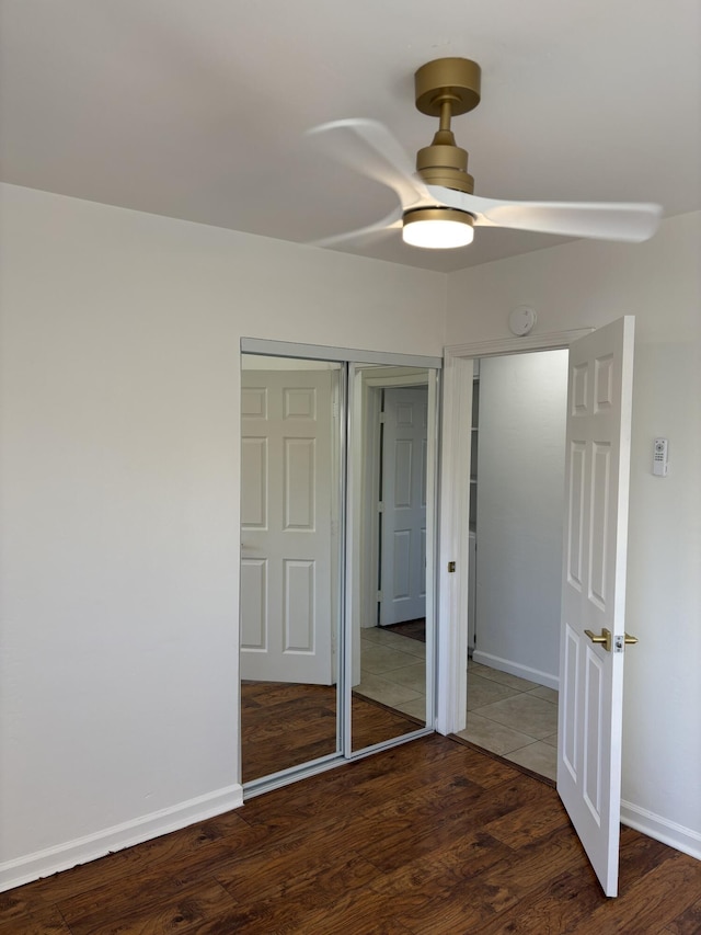 38810 Foxholm Dr, Palmdale, CA 93551 - unfurnished bedroom with wood finished floors, baseboards, and ceiling fan