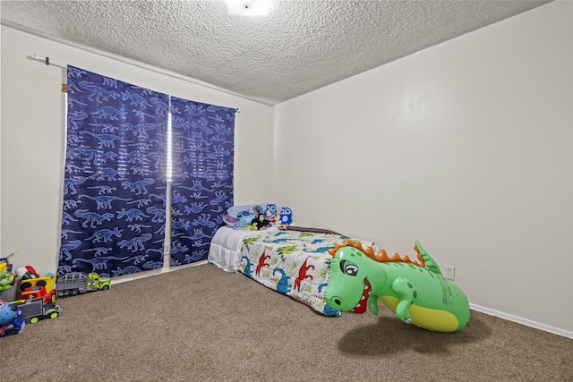 carpeted bedroom with a textured ceiling