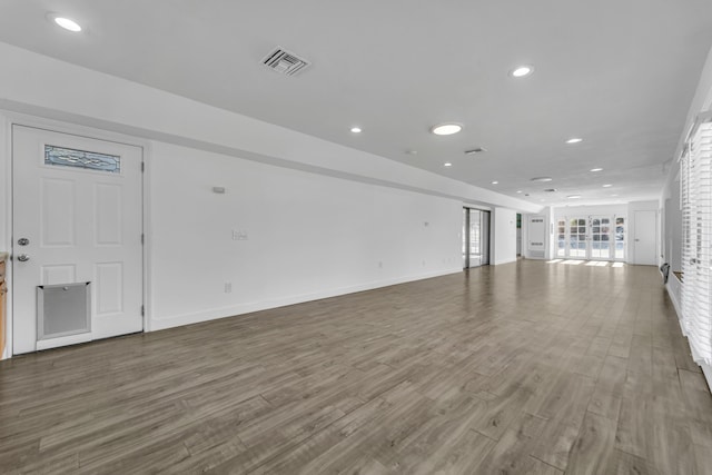 unfurnished living room featuring hardwood / wood-style floors