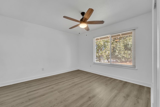 spare room with ceiling fan and light hardwood / wood-style floors