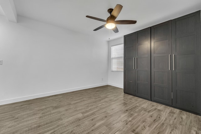 unfurnished bedroom with a closet, ceiling fan, and light hardwood / wood-style floors