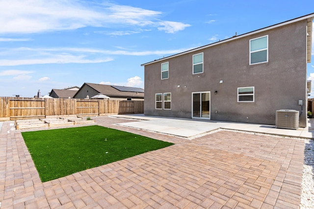 6018 Vespucci Ave, Bakersfield, CA 93313 - rear view of house with central AC, a patio, and stucco siding