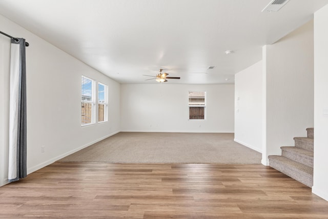 6018 Vespucci Ave, Bakersfield, CA 93313 - unfurnished room with ceiling fan, baseboards, stairs, and light wood-style flooring