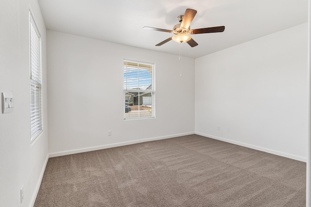 6018 Vespucci Ave, Bakersfield, CA 93313 - spare room featuring carpet floors, baseboards, and ceiling fan