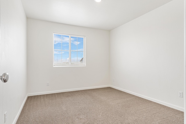 6018 Vespucci Ave, Bakersfield, CA 93313 - spare room featuring carpet floors and baseboards