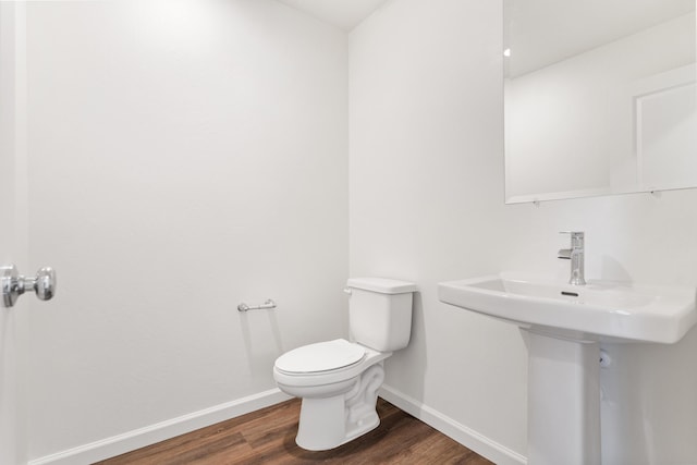 6018 Vespucci Ave, Bakersfield, CA 93313 - bathroom with wood finished floors, baseboards, and toilet