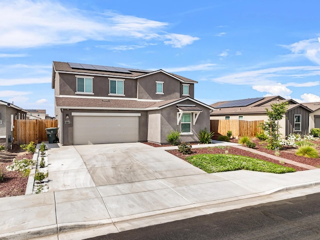 6018 Vespucci Ave, Bakersfield, CA 93313 - traditional-style home featuring stucco siding, solar panels, driveway, and a garage