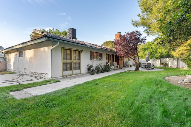 2600 Aland St, Lancaster, CA 93536 - rear view of property featuring a patio, a chimney, and stucco siding