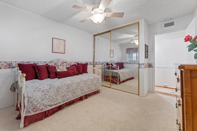 2600 Aland St, Lancaster, CA 93536 - bedroom featuring carpet floors, a closet, a textured ceiling, and ceiling fan