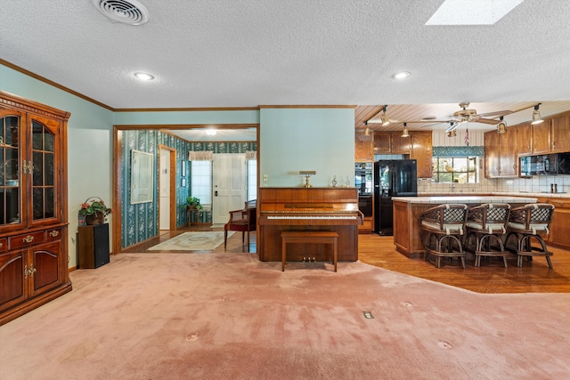 2600 Aland St, Lancaster, CA 93536 - living area featuring crown molding, light colored carpet, a textured ceiling, ceiling fan, and recessed lighting