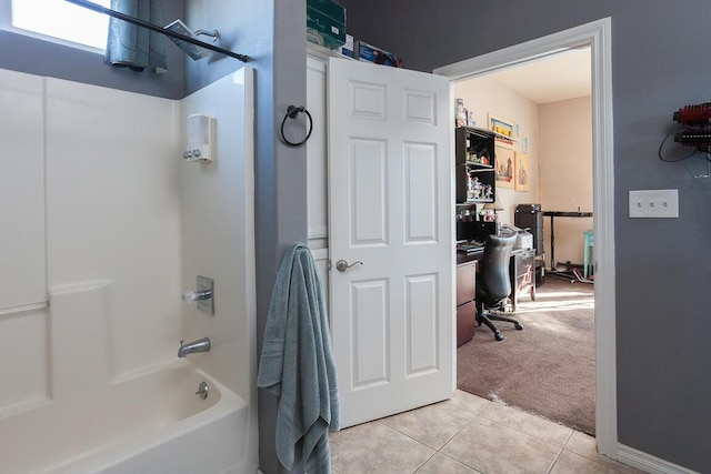 bathroom featuring tile patterned flooring and tub / shower combination
