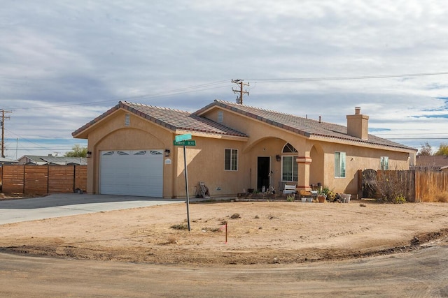 view of front of property with a garage