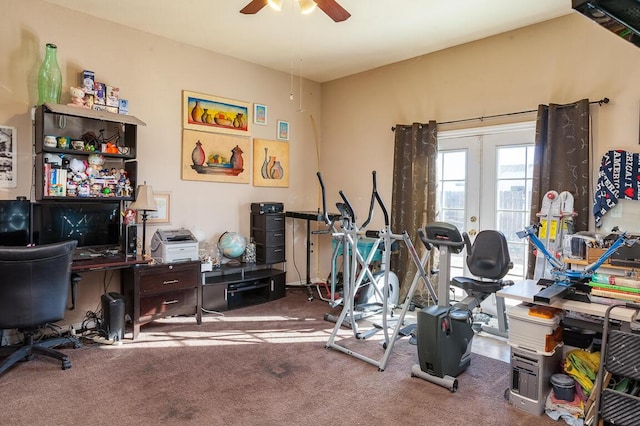 exercise area with carpet flooring, french doors, and ceiling fan