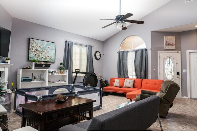 living room with tile patterned floors, high vaulted ceiling, and ceiling fan