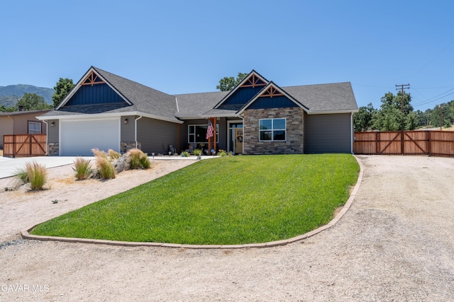 28380 Pimlico Way, Tehachapi, CA 93561 - craftsman-style home with stone siding, a garage, driveway, and board and batten siding