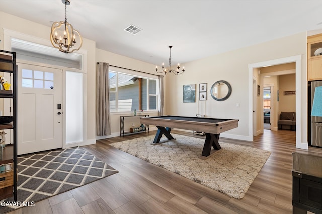 28380 Pimlico Way, Tehachapi, CA 93561 - entrance foyer featuring a chandelier, wood finished floors, healthy amount of natural light, and billiards