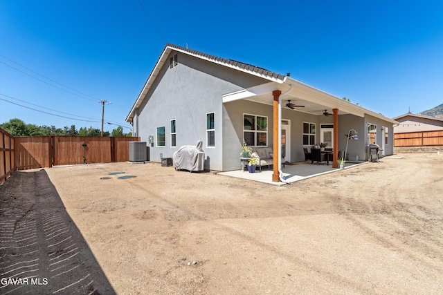 28380 Pimlico Way, Tehachapi, CA 93561 - rear view of property featuring a ceiling fan, a patio area, a fenced backyard, and stucco siding