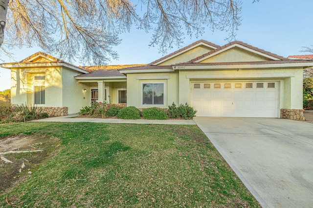 view of front facade with a garage and a front lawn