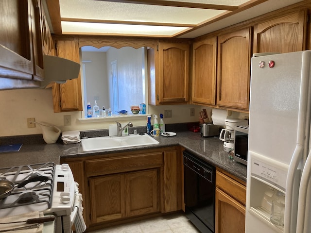 kitchen with sink and white appliances