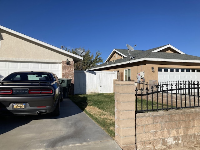 view of side of home with a garage