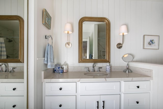 bathroom with vanity and a shower with shower curtain