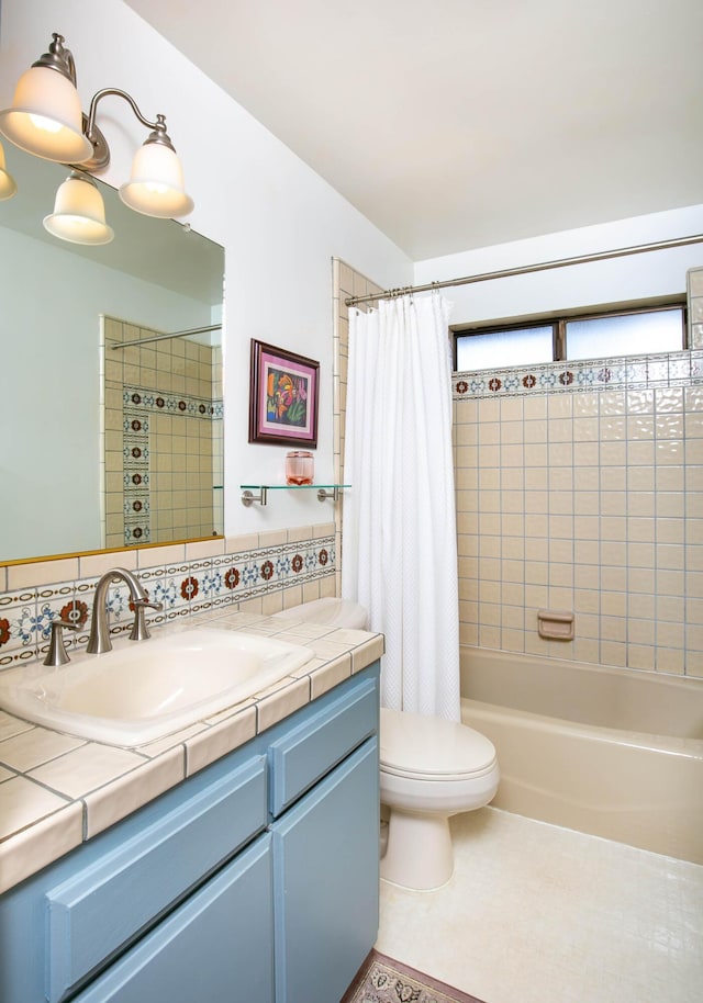 full bathroom with shower / tub combo with curtain, tile patterned flooring, vanity, tasteful backsplash, and toilet