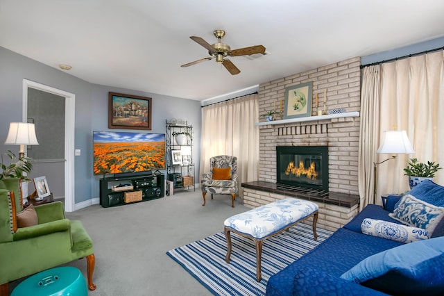 living room featuring a brick fireplace, ceiling fan, and carpet flooring