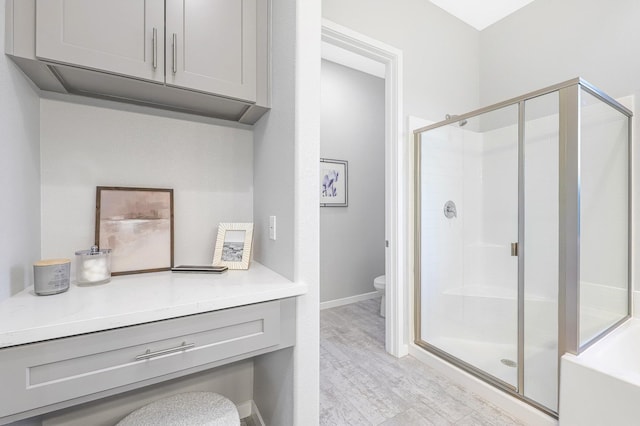 40127 Pevero Ct, Palmdale, CA 93551 - bathroom featuring a stall shower and wood finished floors