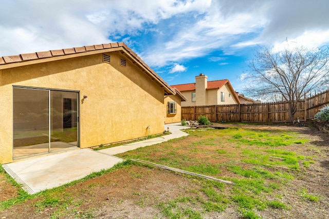 view of yard featuring a patio area and fence