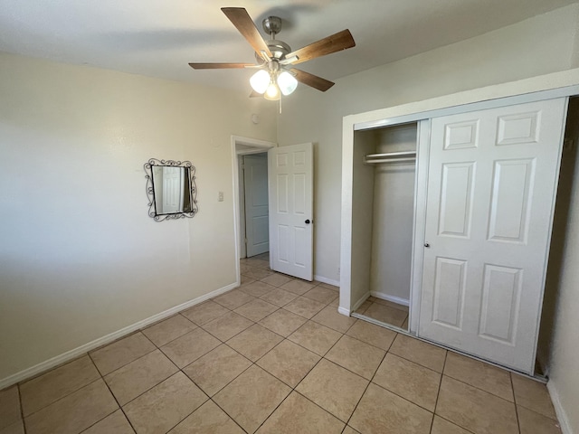 2010 W Lumber St, Lancaster, CA 93536 - unfurnished bedroom featuring light tile patterned floors, a closet, baseboards, and ceiling fan