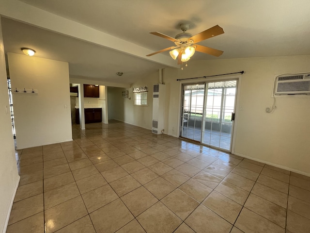 2010 W Lumber St, Lancaster, CA 93536 - spare room featuring light tile patterned floors, ceiling fan, a wall unit AC, and a fireplace