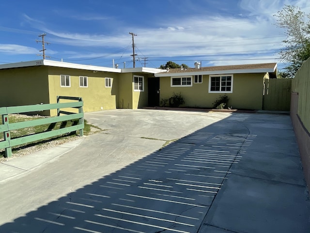 2010 W Lumber St, Lancaster, CA 93536 - rear view of property with stucco siding and fence