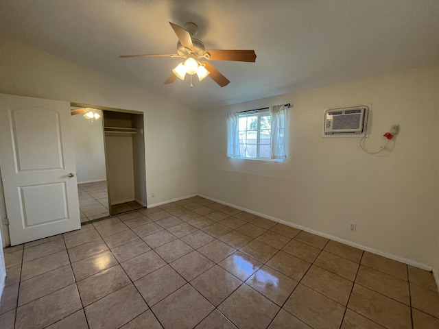2010 W Lumber St, Lancaster, CA 93536 - unfurnished bedroom with light tile patterned floors, a closet, vaulted ceiling, baseboards, and ceiling fan