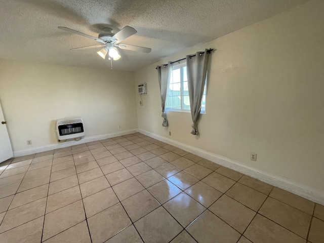 2010 W Lumber St, Lancaster, CA 93536 - spare room featuring heating unit, a textured ceiling, ceiling fan, light tile patterned flooring, and a wall mounted AC