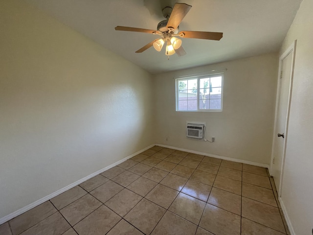 2010 W Lumber St, Lancaster, CA 93536 - spare room featuring light tile patterned floors, a wall mounted AC, ceiling fan, and baseboards